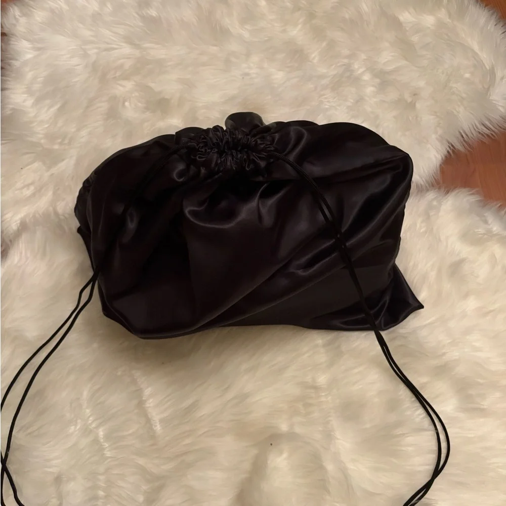 Black silky dust bag drawstrings